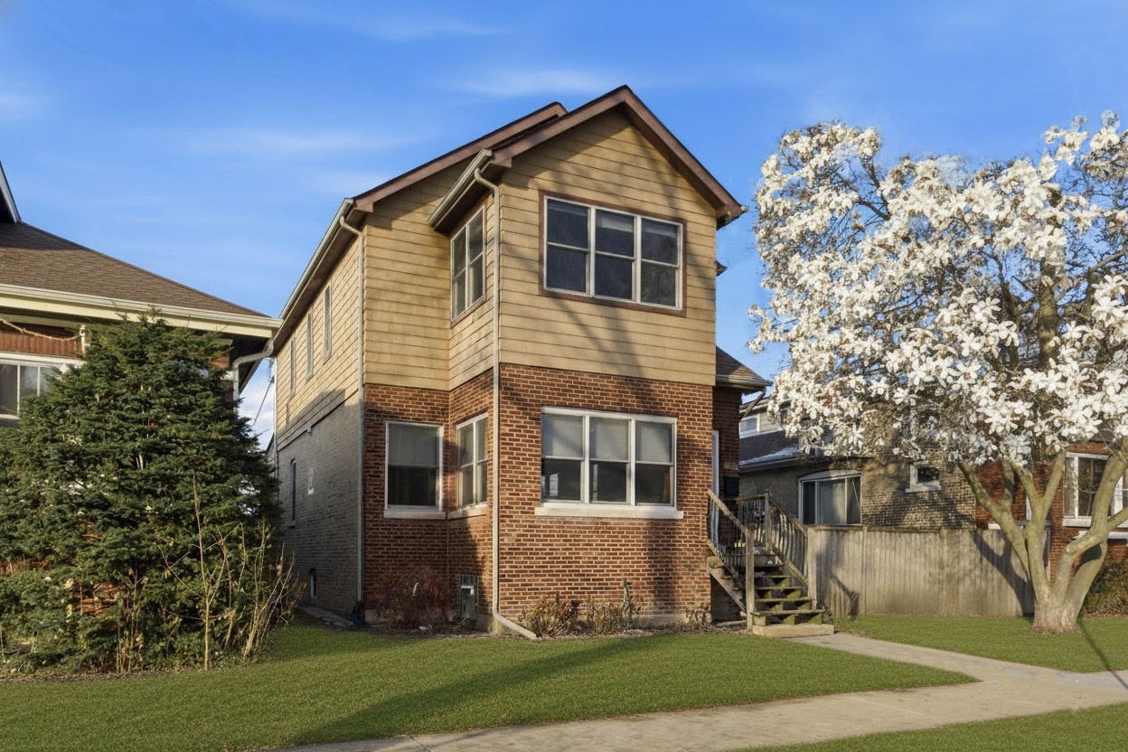 3814 North Mozart Street Chicago, IL 60618 - Photo 1 of 37 a front view of a house with a yard
