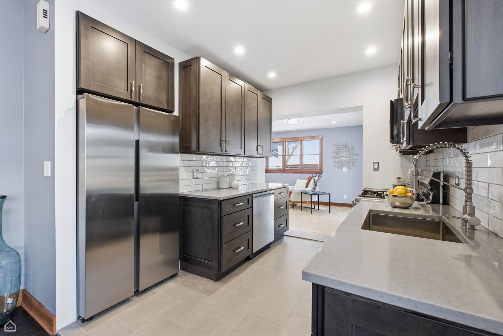 3814 North Mozart Street Chicago, IL 60618 - Photo 12 of 37 a kitchen with stainless steel appliances a refrigerator sink and stove