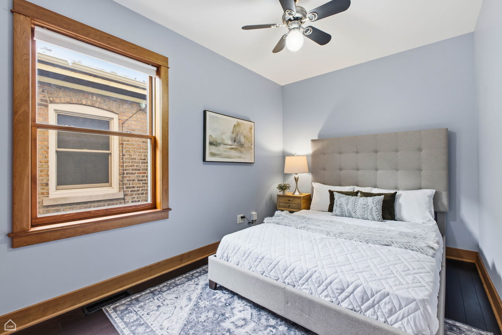 3814 North Mozart Street Chicago, IL 60618 - Photo 18 of 37 a bedroom with a large bed and a window
