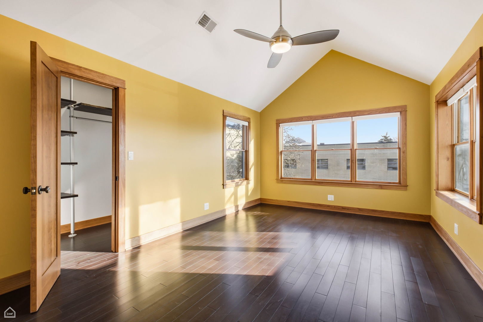 3814 North Mozart Street Chicago, IL 60618 - Photo 19 of 37 a view of empty room with wooden floor and fan