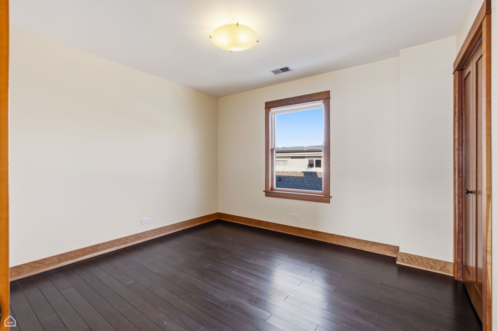 3814 North Mozart Street Chicago, IL 60618 - Photo 21 of 37 an empty room with wooden floor and windows