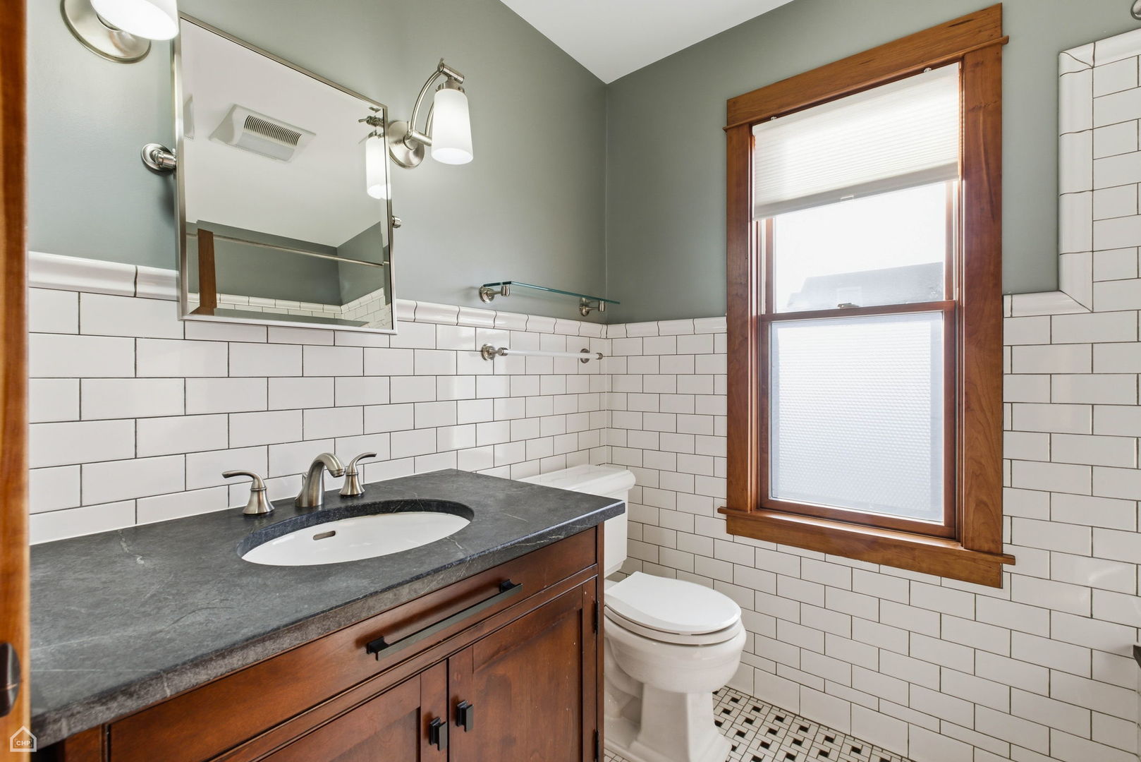 3814 North Mozart Street Chicago, IL 60618 - Photo 22 of 37 a bathroom with a sink toilet and mirror