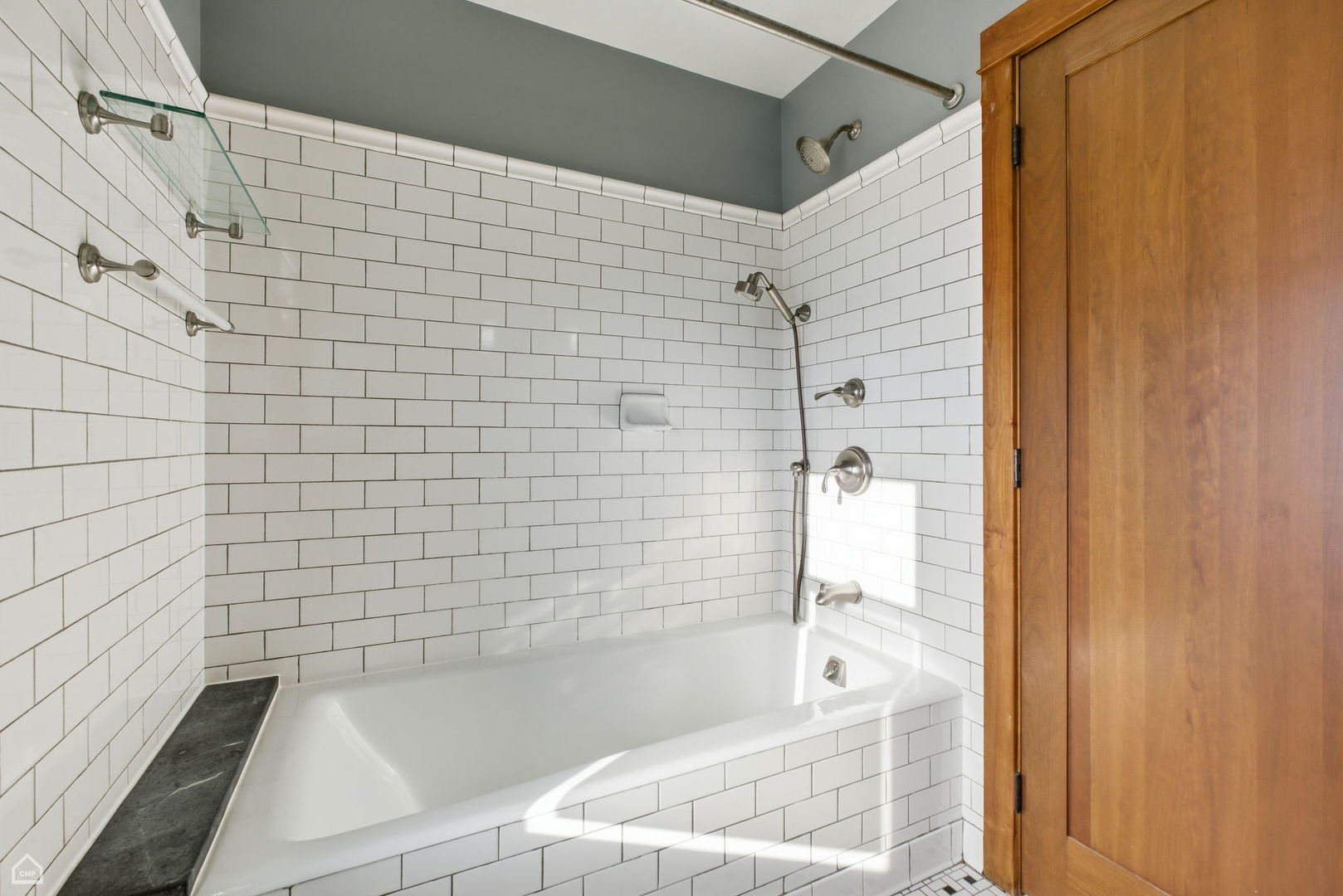 3814 North Mozart Street Chicago, IL 60618 - Photo 23 of 37 a bathroom with a bathtub and shower
