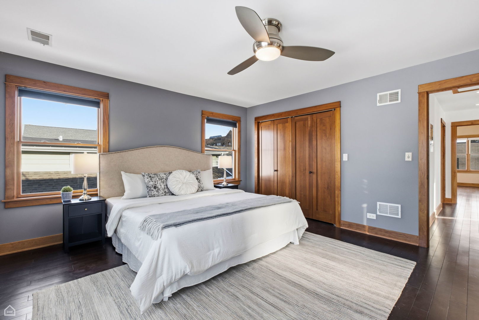 3814 North Mozart Street Chicago, IL 60618 - Photo 25 of 37 a bedroom with a large bed chandelier and a window