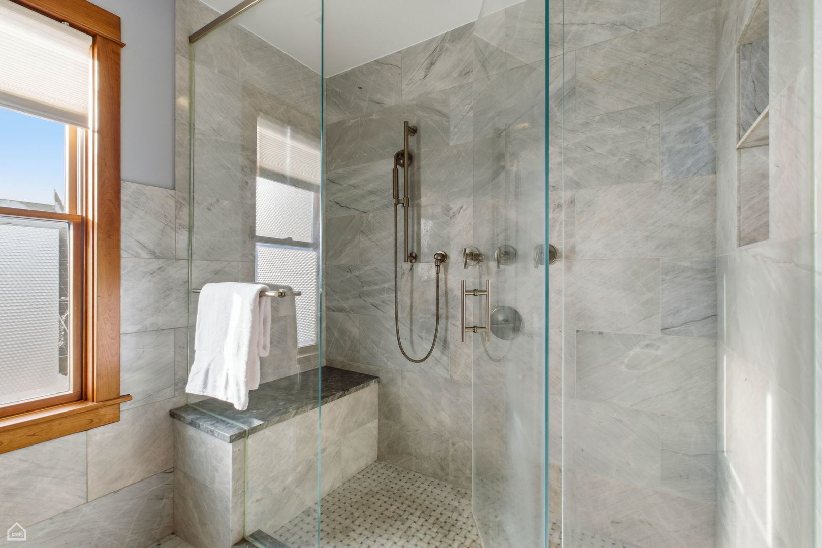 3814 North Mozart Street Chicago, IL 60618 - Photo 28 of 37 a bathroom with a granite countertop shower a mirror and a shower