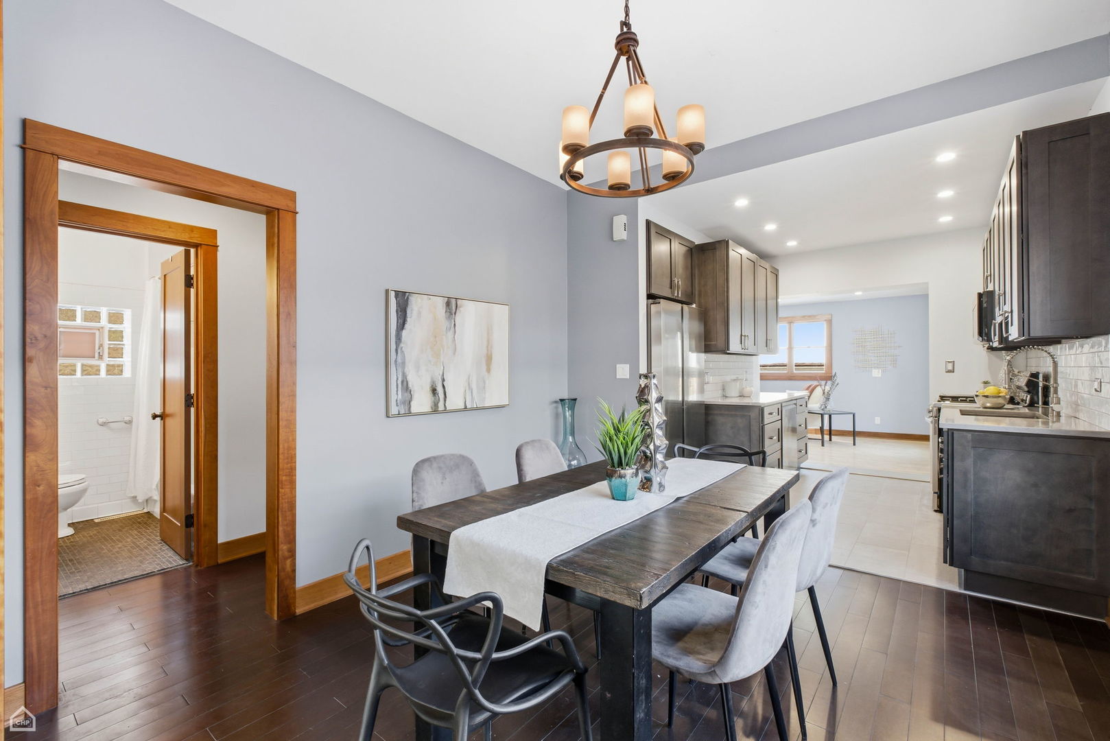 3814 North Mozart Street Chicago, IL 60618 - Photo 8 of 37 a view of a dining room with furniture wooden floor and chandelier