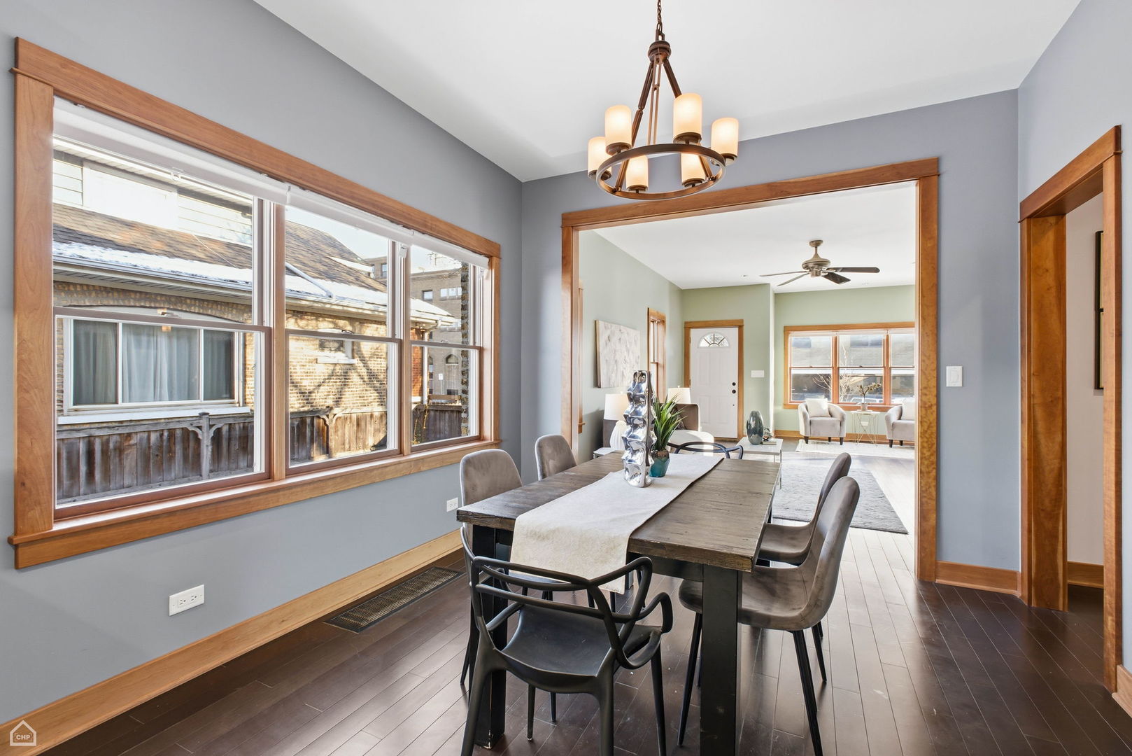 3814 North Mozart Street Chicago, IL 60618 - Photo 9 of 37 a view of a dining room with furniture window and wooden floor
