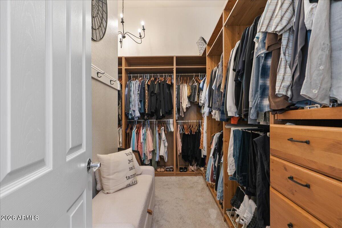 6427 South Magic Court Gilbert, AZ 85298 - Photo 34 of 71 a view of walk in closet with clothes and shoes