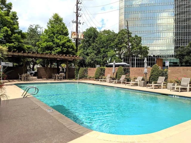a view of a swimming pool with a patio
