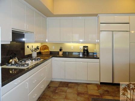 54595 Winged Foot La Quinta, CA 92253 - Photo 11 of 19 a kitchen with a sink a stove and cabinets