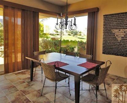 54595 Winged Foot La Quinta, CA 92253 - Photo 13 of 19 a dining room with furniture and window