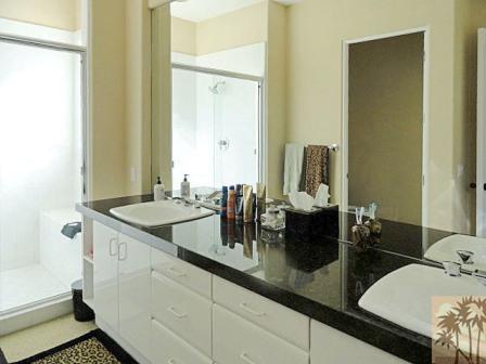 54595 Winged Foot La Quinta, CA 92253 - Photo 16 of 19 a bathroom with a granite countertop sink and a mirror