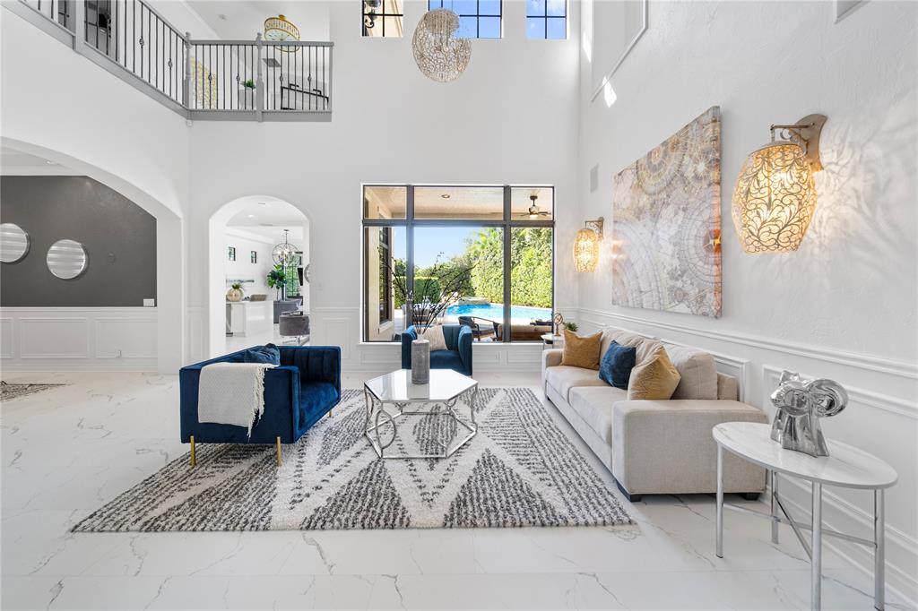 6915 Long Leaf Drive Parkland, FL 33076 - Photo 1 of 80 a living room with furniture and a large window