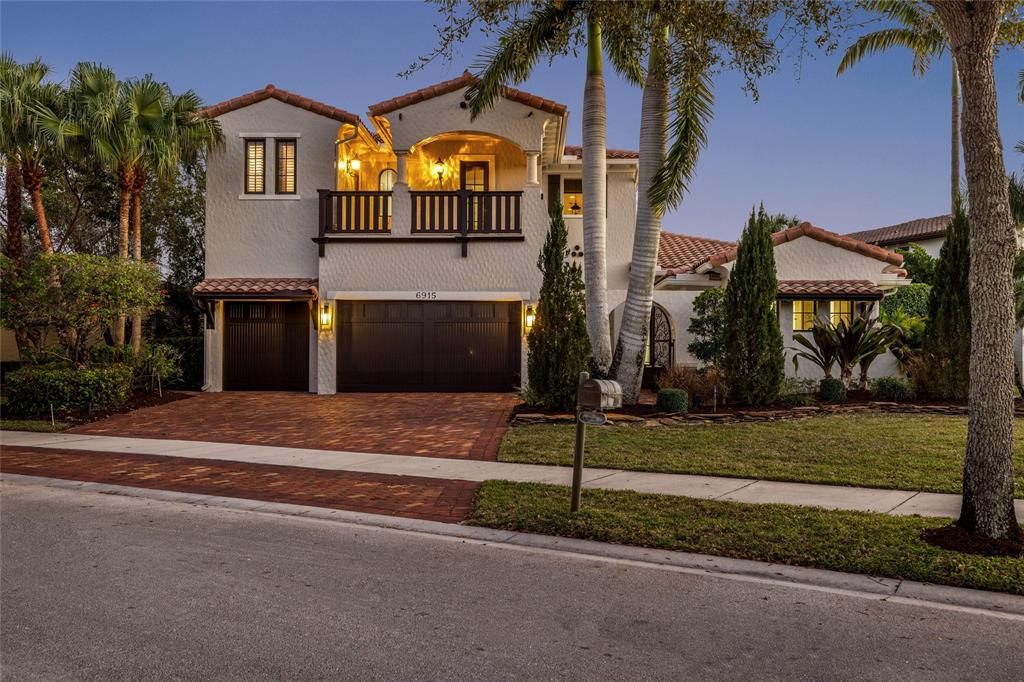 6915 Long Leaf Drive Parkland, FL 33076 - Photo 14 of 80 a front view of a house with a yard and garage