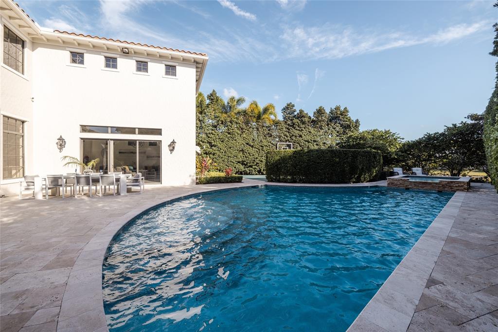6915 Long Leaf Drive Parkland, FL 33076 - Photo 44 of 80 a view of a swimming pool with outdoor seating