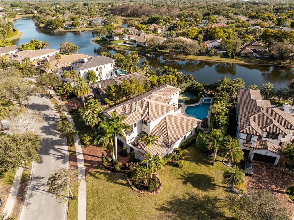6915 Long Leaf Drive Parkland, FL 33076 - Photo 66 of 80 an aerial view of residential houses with outdoor space