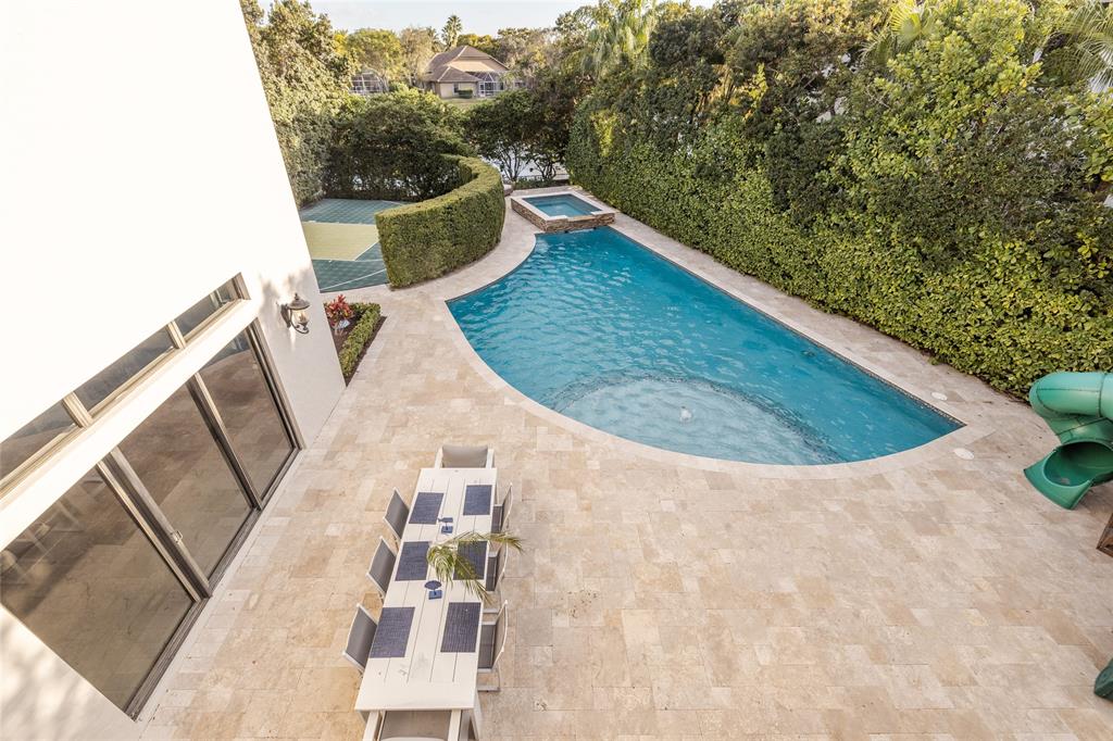 6915 Long Leaf Drive Parkland, FL 33076 - Photo 79 of 80 a view of a swimming pool with back yard of the house