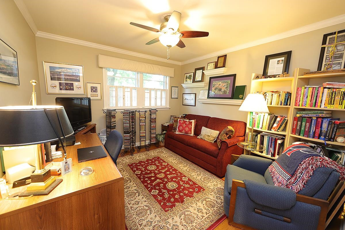 2505 Medway Drive Raleigh, NC 27608 - Photo 14 of 18 a living room with furniture and a flat screen tv