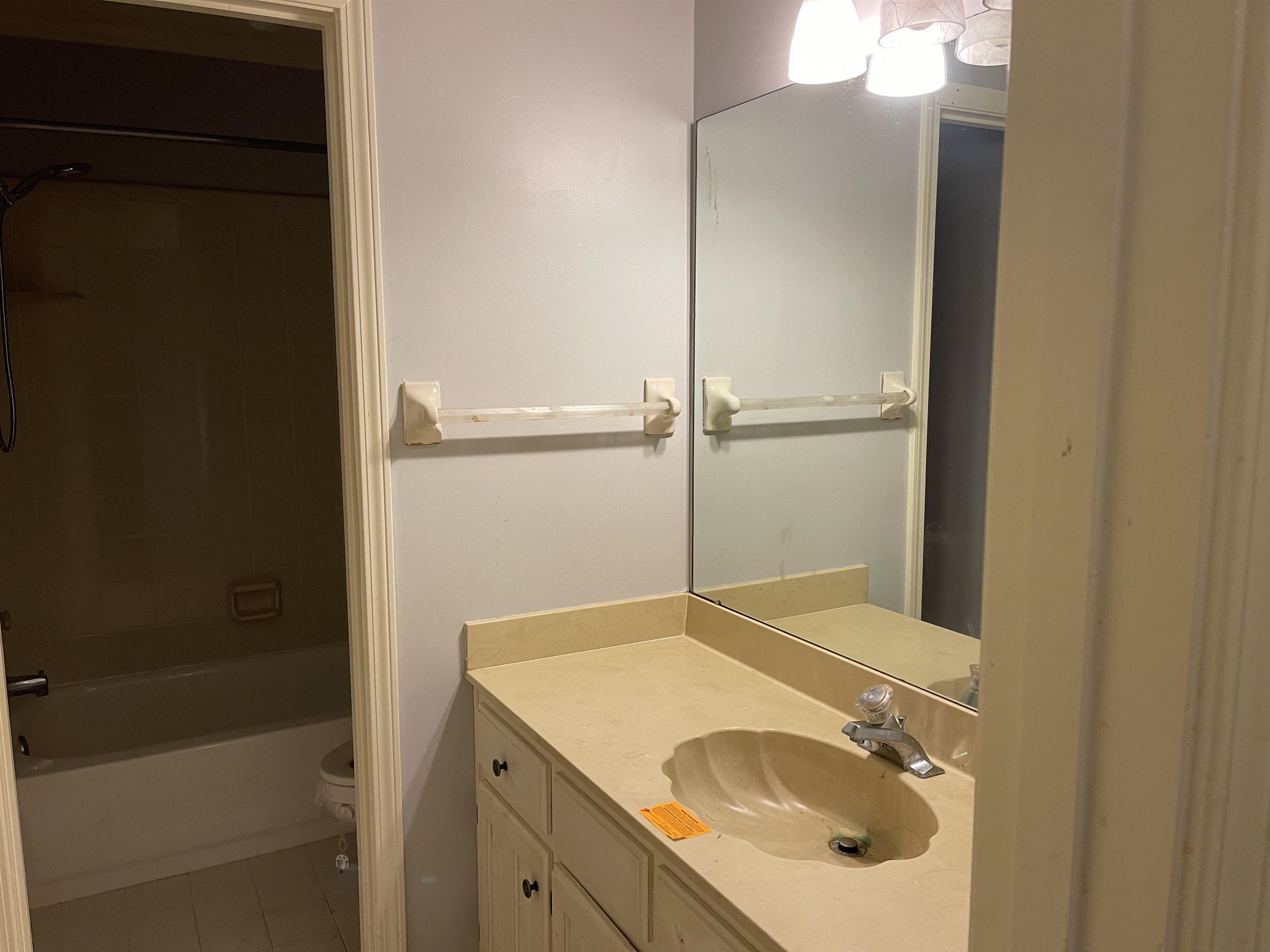 9220 Davies Plantation Road Bartlett, TN 38133 - Photo 18 of 19 Full bathroom featuring toilet, vanity, tile patterned floors, and shower / washtub combination