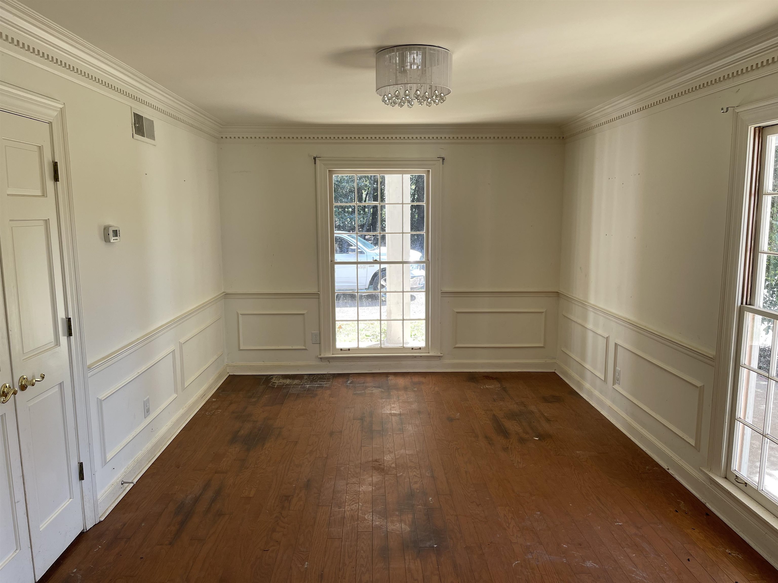 9220 Davies Plantation Road Bartlett, TN 38133 - Photo 4 of 19 Dining room with an inviting chandelier, crown molding, and dark hardwood / wood-style flooring