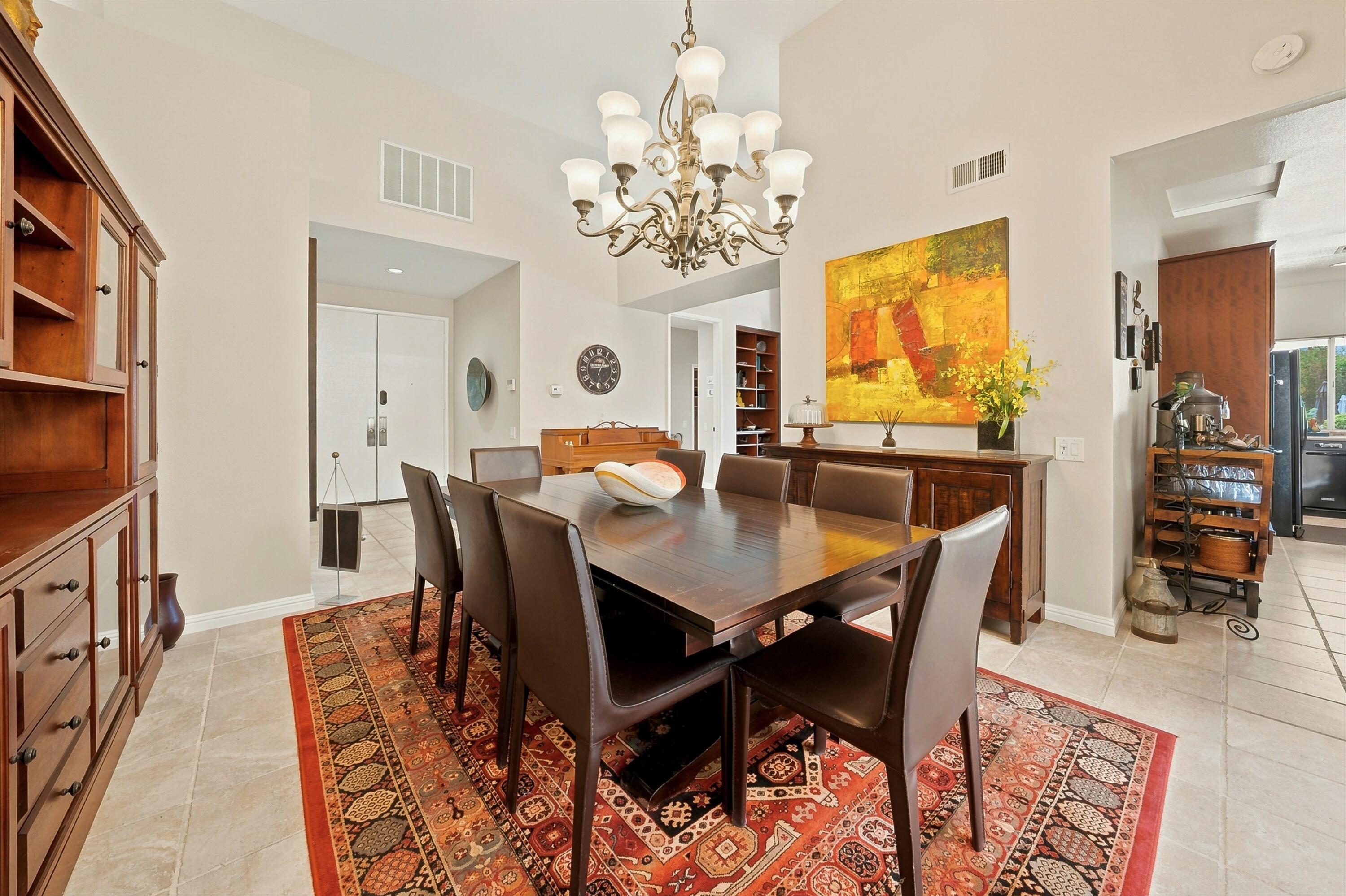 138 Lakeshore Drive Rancho Mirage, CA 92270 - Photo 5 of 30 a view of a dining room with furniture and chandelier