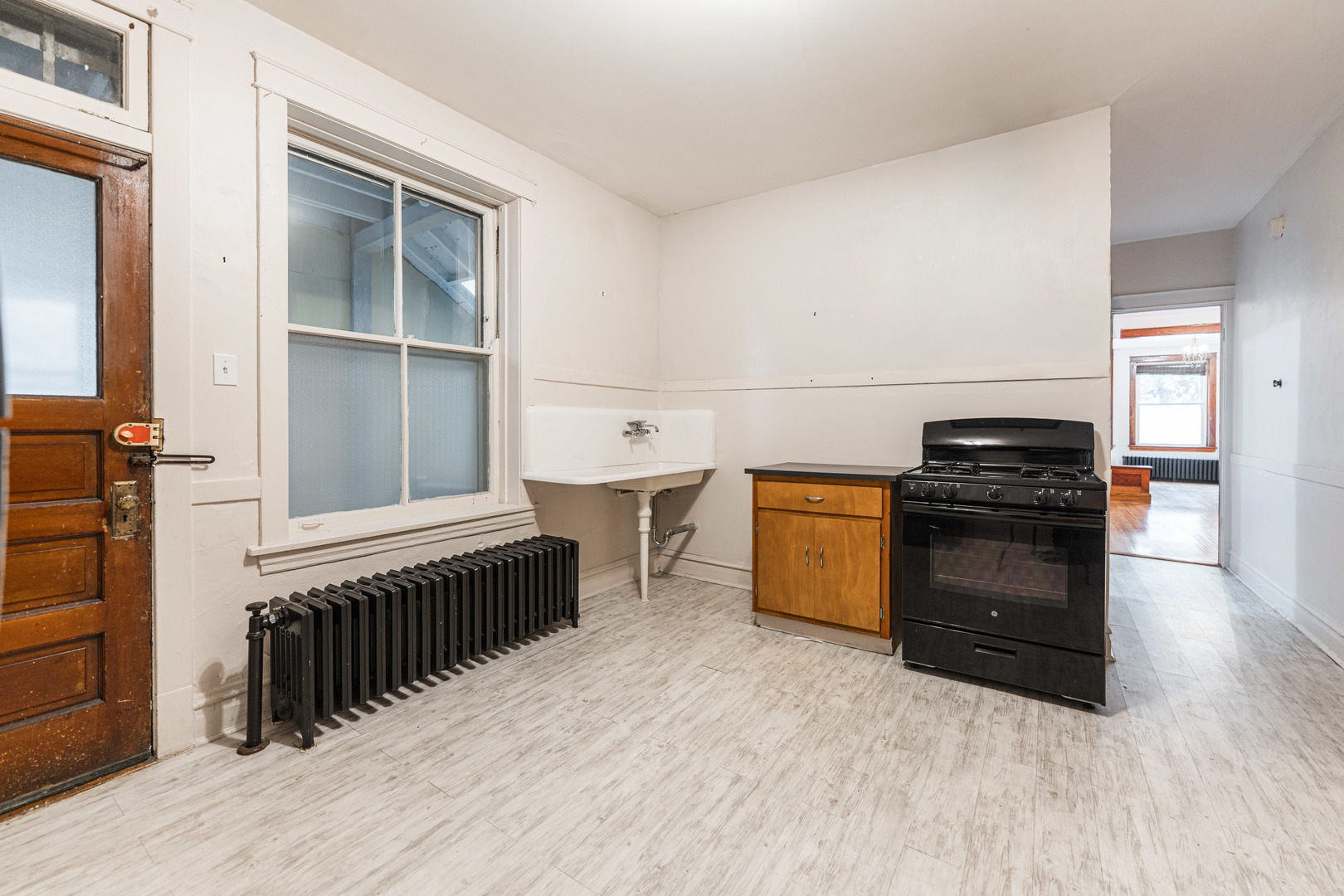2257 North Springfield Avenue, Unit 1F Chicago, IL 60647 - Photo 11 of 27 a kitchen with a stove and a microwave