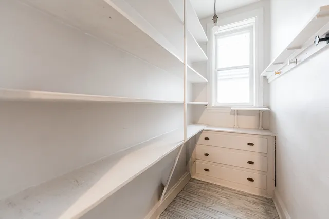 a view of an empty walk in closet