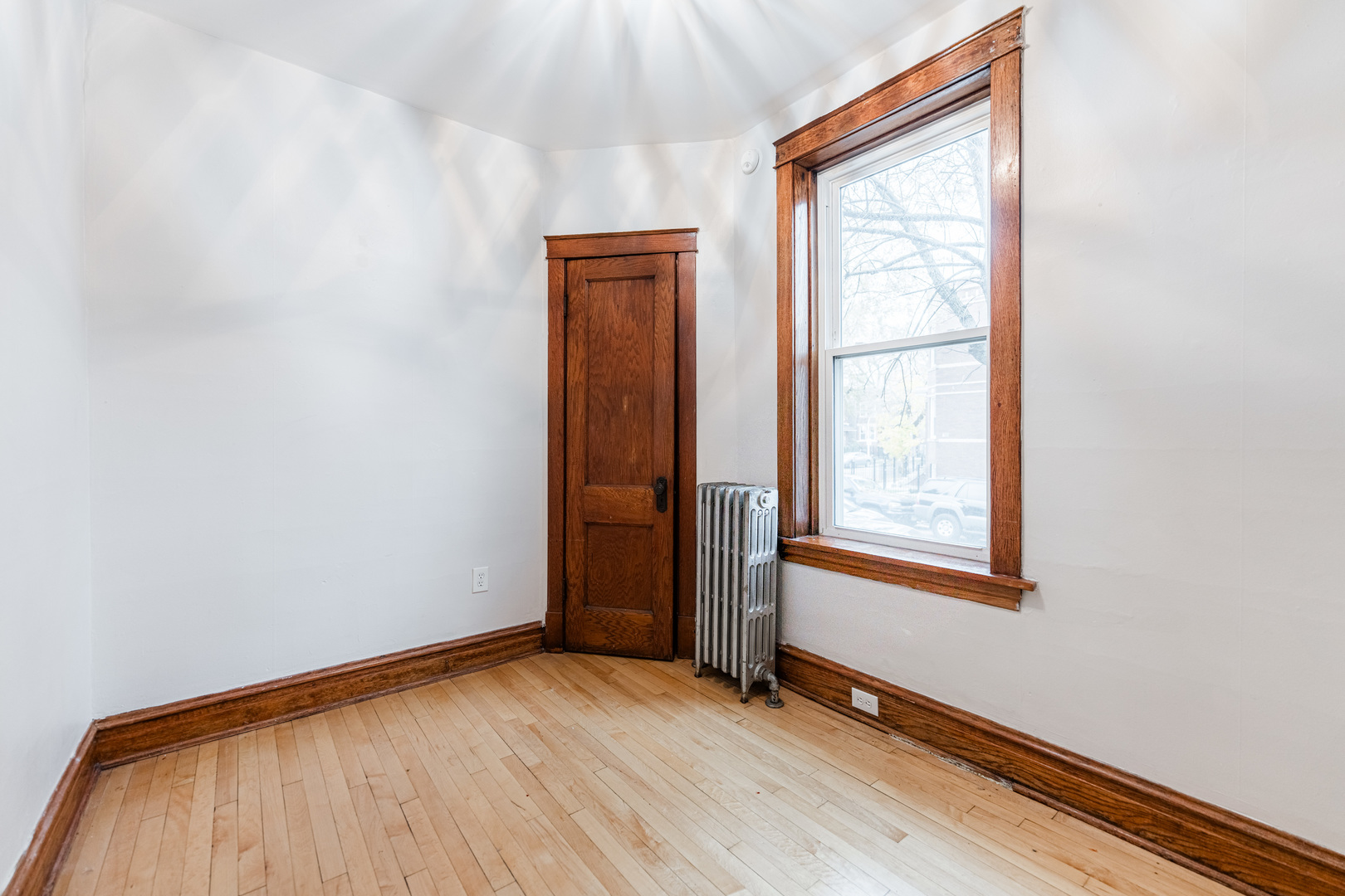 2257 North Springfield Avenue, Unit 1F Chicago, IL 60647 - Photo 18 of 27 an empty room with windows