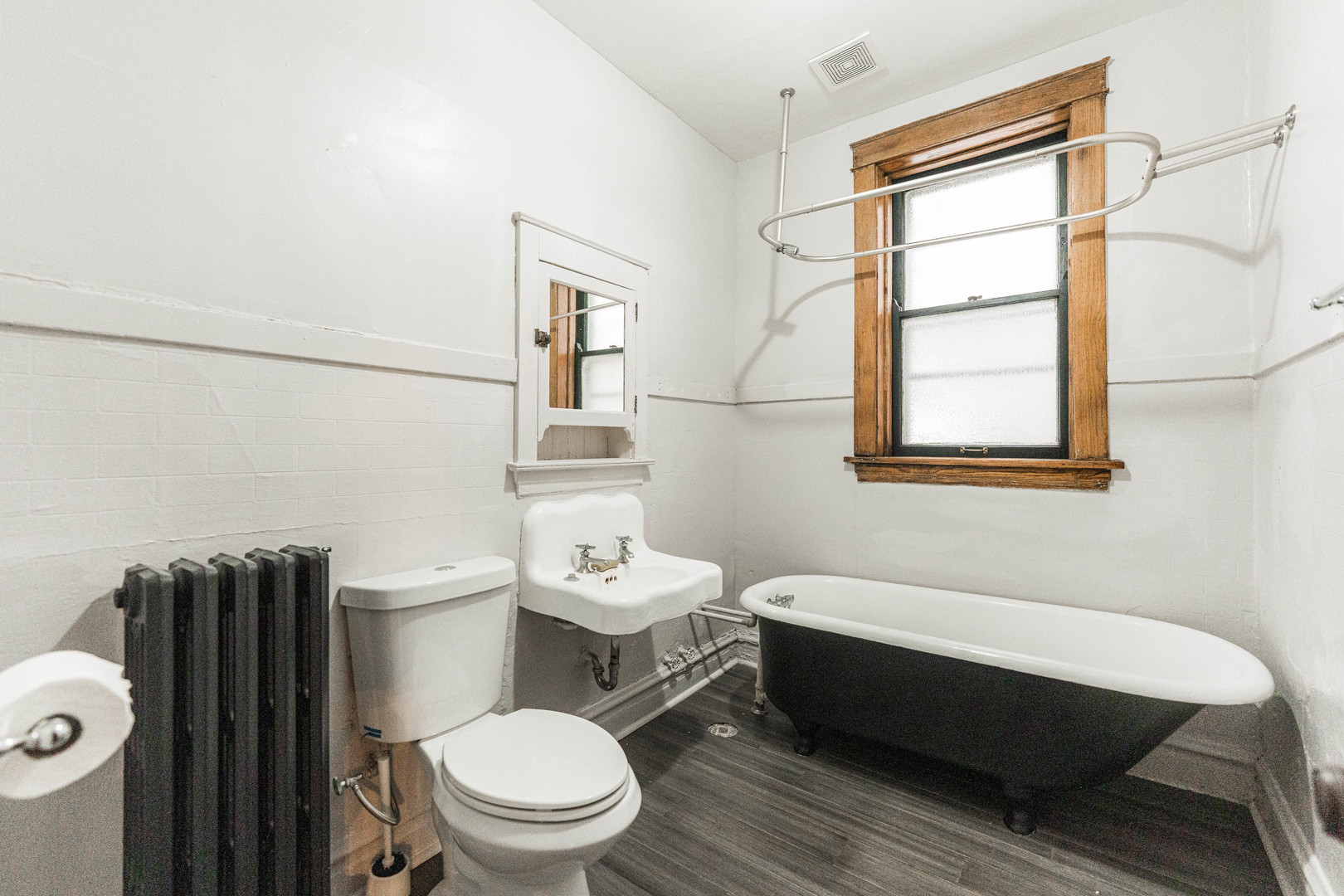 2257 North Springfield Avenue, Unit 1F Chicago, IL 60647 - Photo 20 of 27 a bathroom with a toilet a sink and a mirror