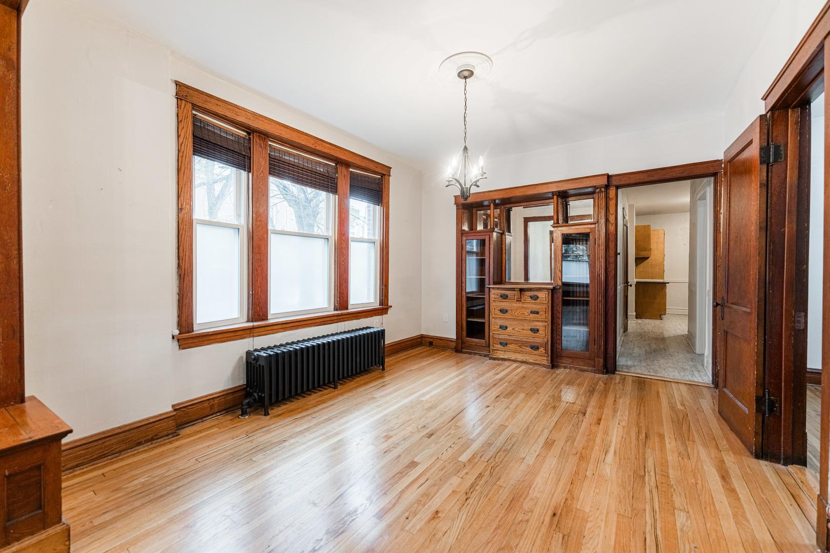 2257 North Springfield Avenue, Unit 1F Chicago, IL 60647 - Photo 7 of 27 a view of an empty room and window