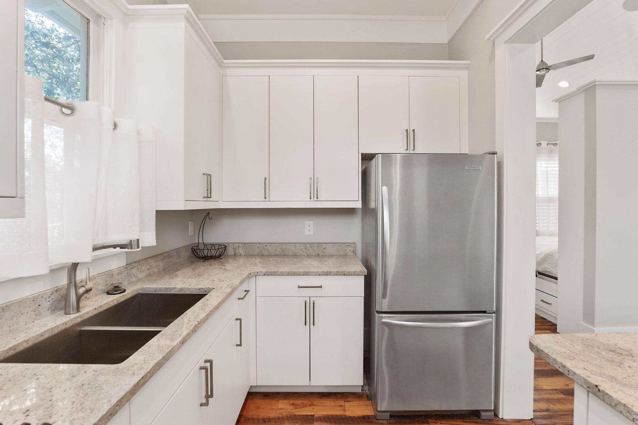 83 Compass Point Way Watersound, FL 32461 - Photo 6 of 17 a kitchen with a refrigerator sink and cabinets