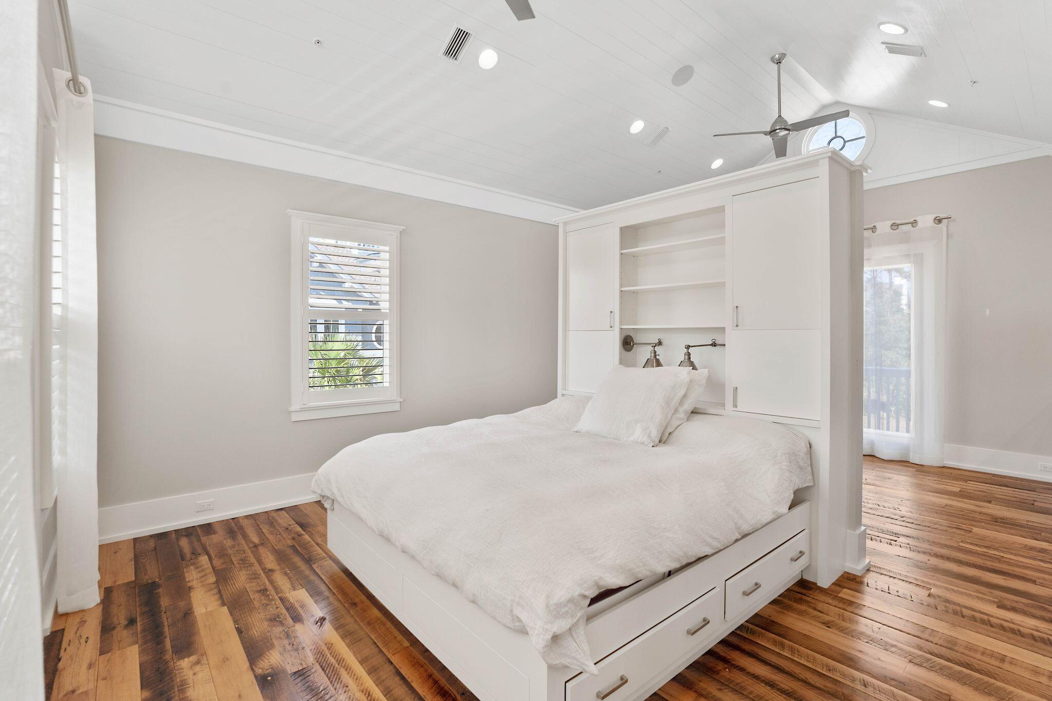 83 Compass Point Way Watersound, FL 32461 - Photo 10 of 17 a bedroom with a bed and a window