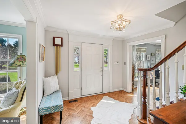 a bedroom with furniture and a chandelier