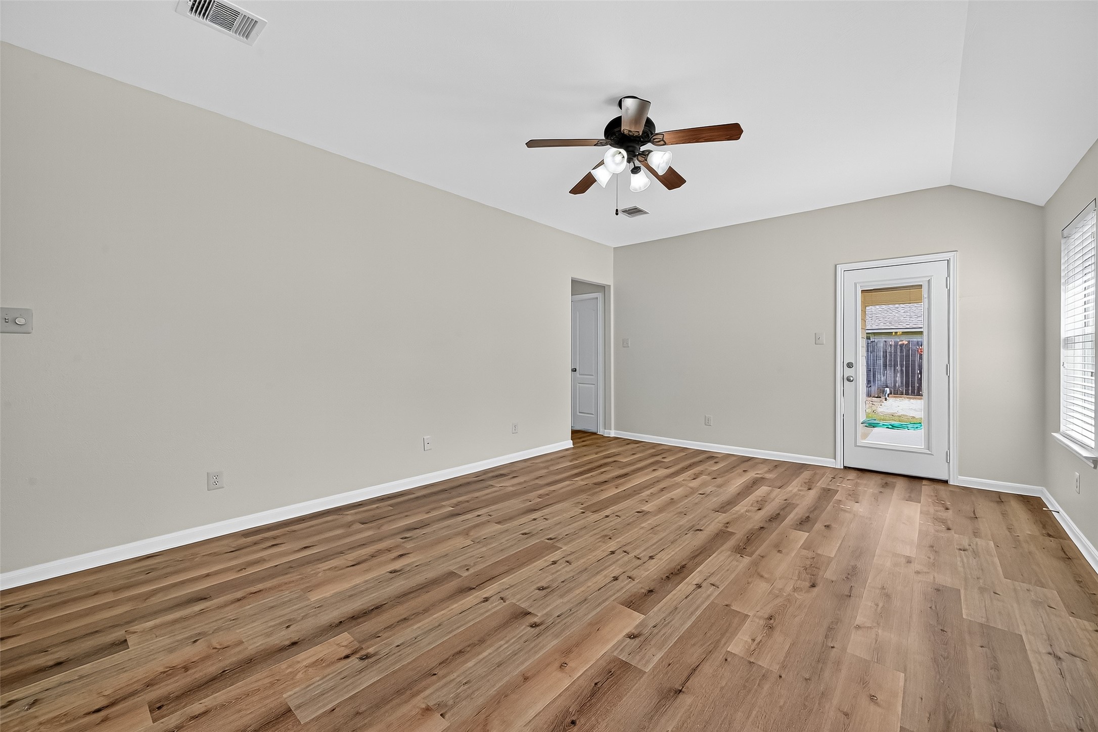 3114 Sabine Spring Lane Katy, TX 77449 - Photo 14 of 34 a view of empty room with wooden floor and fan