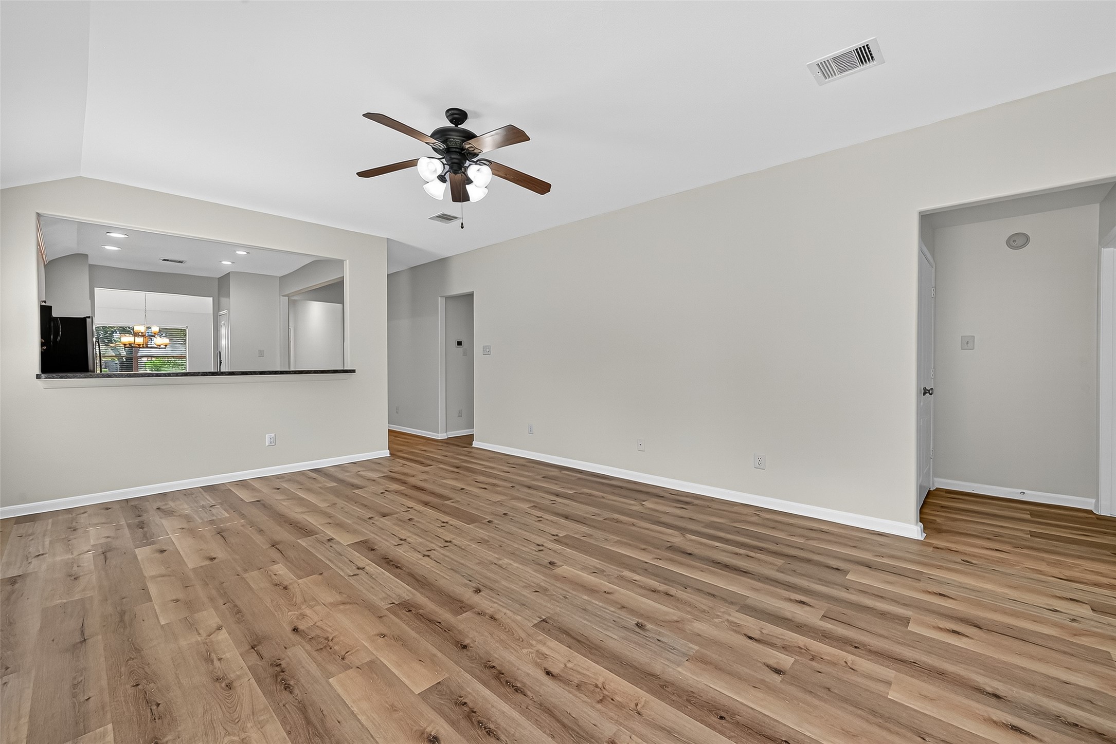 3114 Sabine Spring Lane Katy, TX 77449 - Photo 15 of 34 a view of empty room with wooden floor and fan