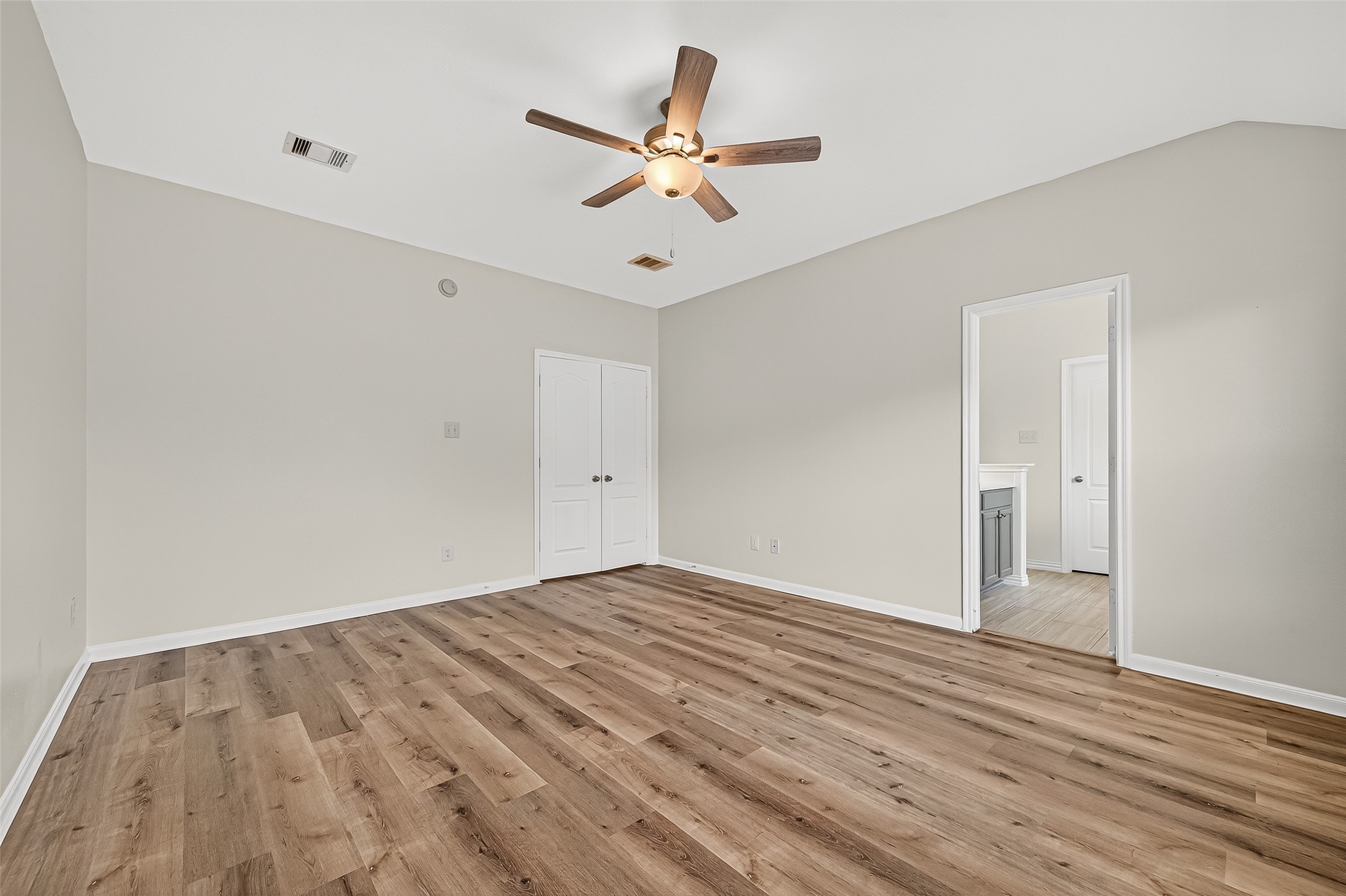 3114 Sabine Spring Lane Katy, TX 77449 - Photo 18 of 34 wooden floor in an empty room