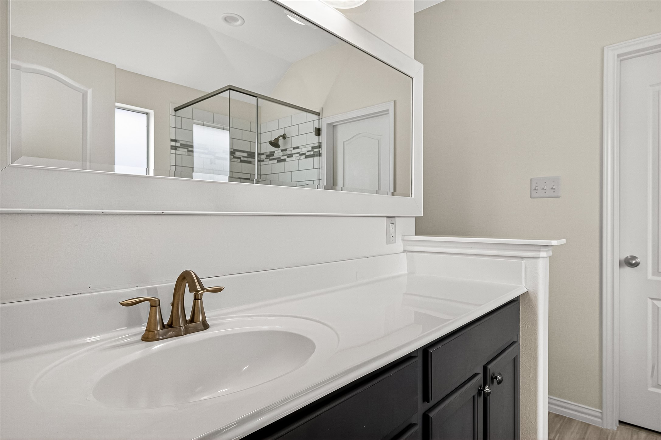 3114 Sabine Spring Lane Katy, TX 77449 - Photo 19 of 34 a bathroom with a sink and a mirror