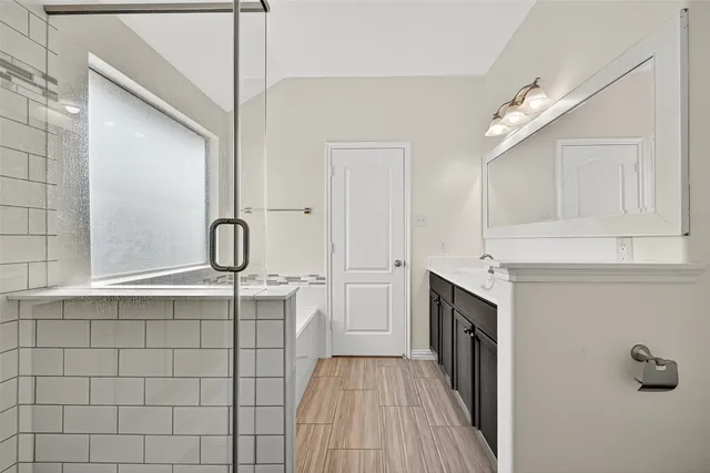 a kitchen with a sink cabinets and stainless steel appliances