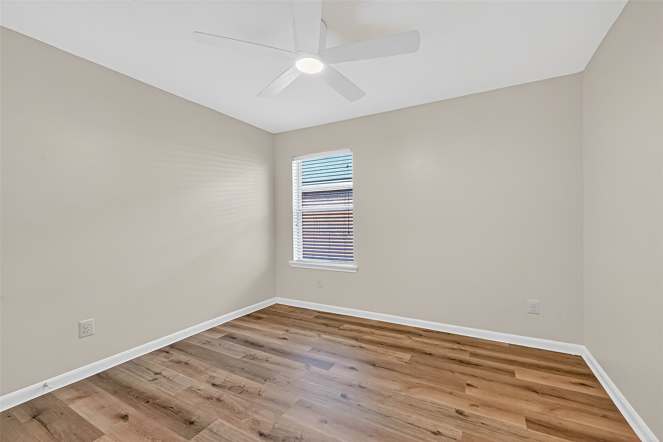 3114 Sabine Spring Lane Katy, TX 77449 - Photo 25 of 34 a view of empty room with wooden floor and fan
