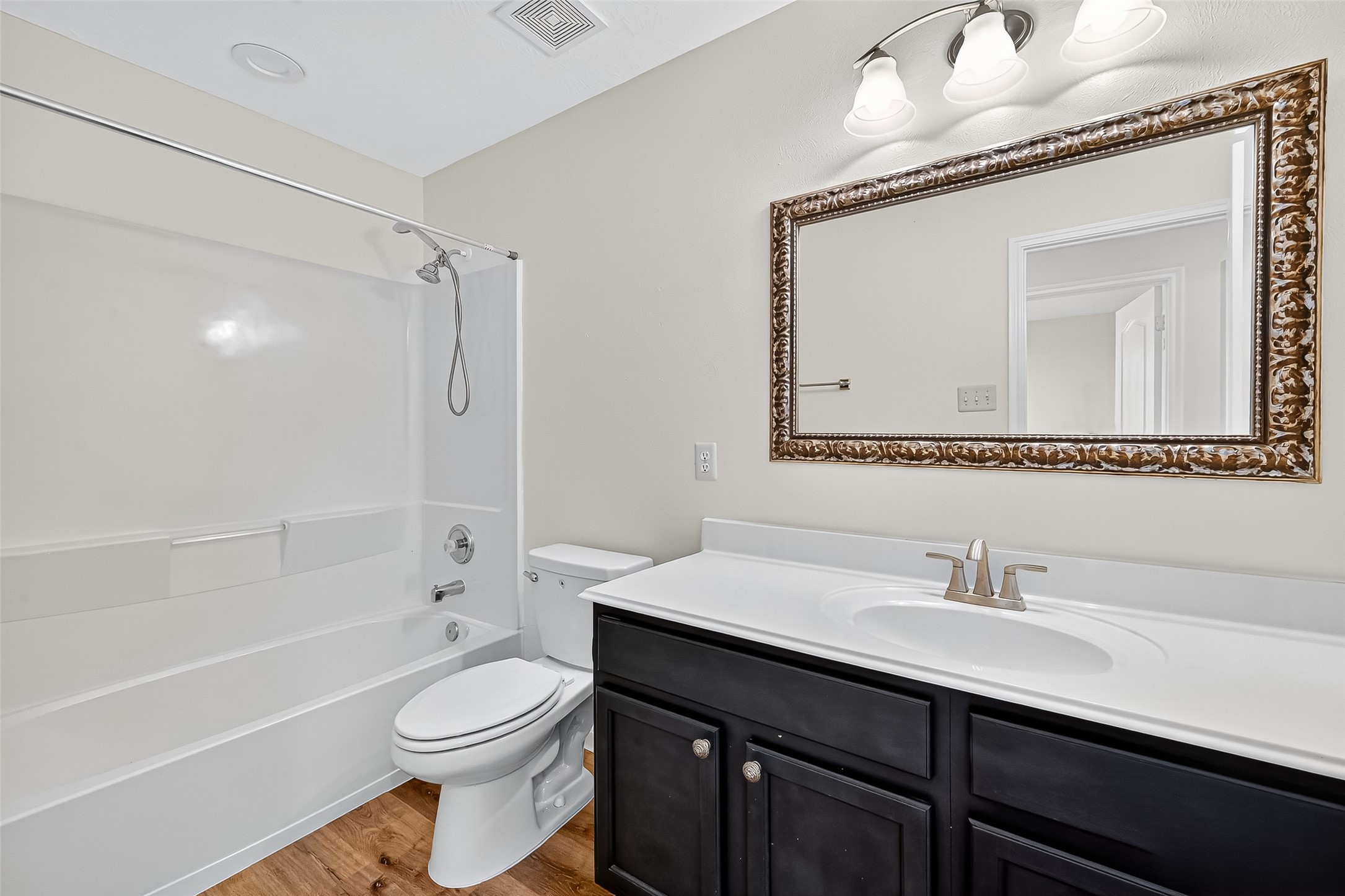 3114 Sabine Spring Lane Katy, TX 77449 - Photo 27 of 34 a bathroom with a sink a toilet and shower