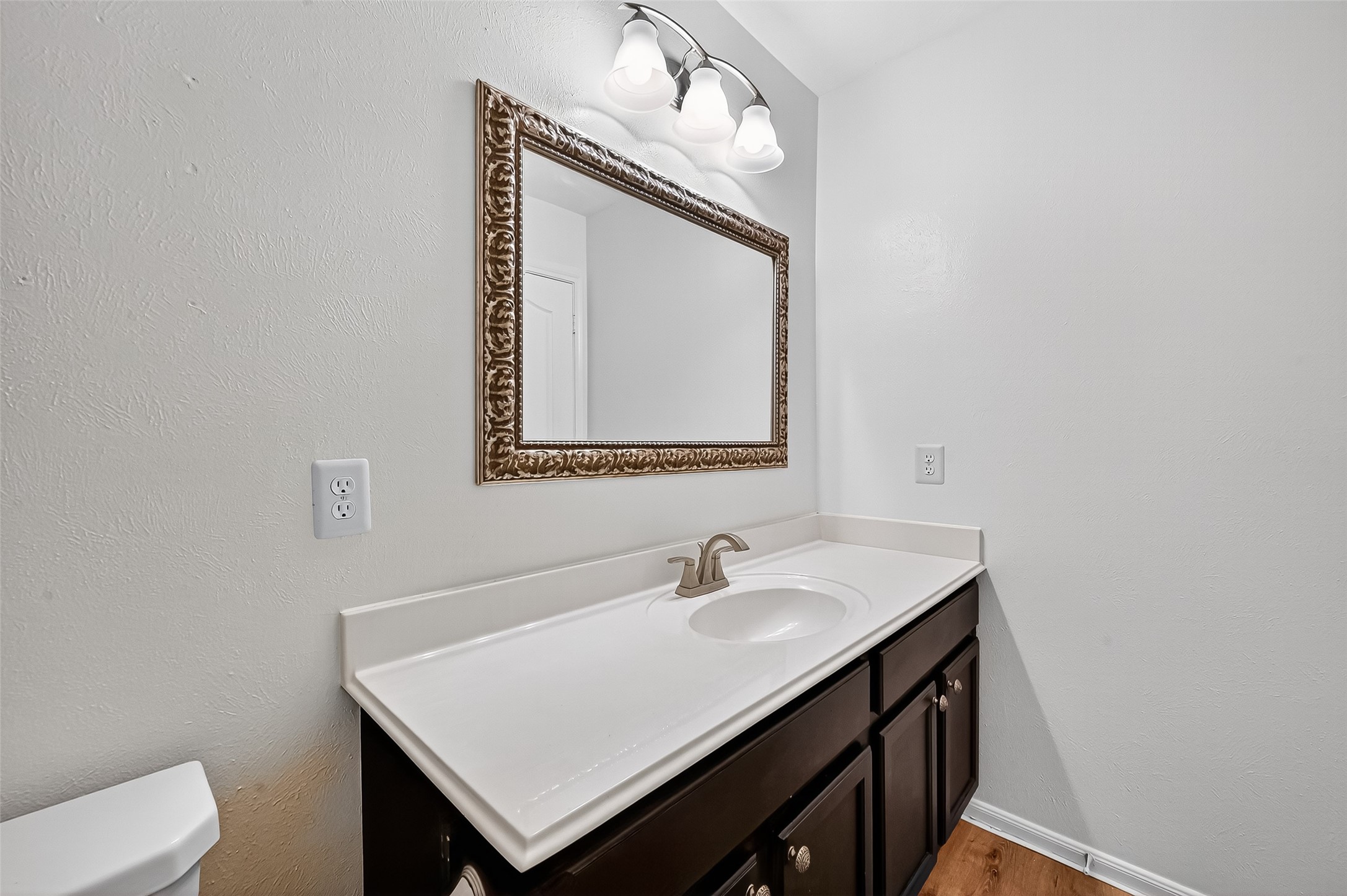 3114 Sabine Spring Lane Katy, TX 77449 - Photo 29 of 34 a bathroom with a sink vanity and a mirror