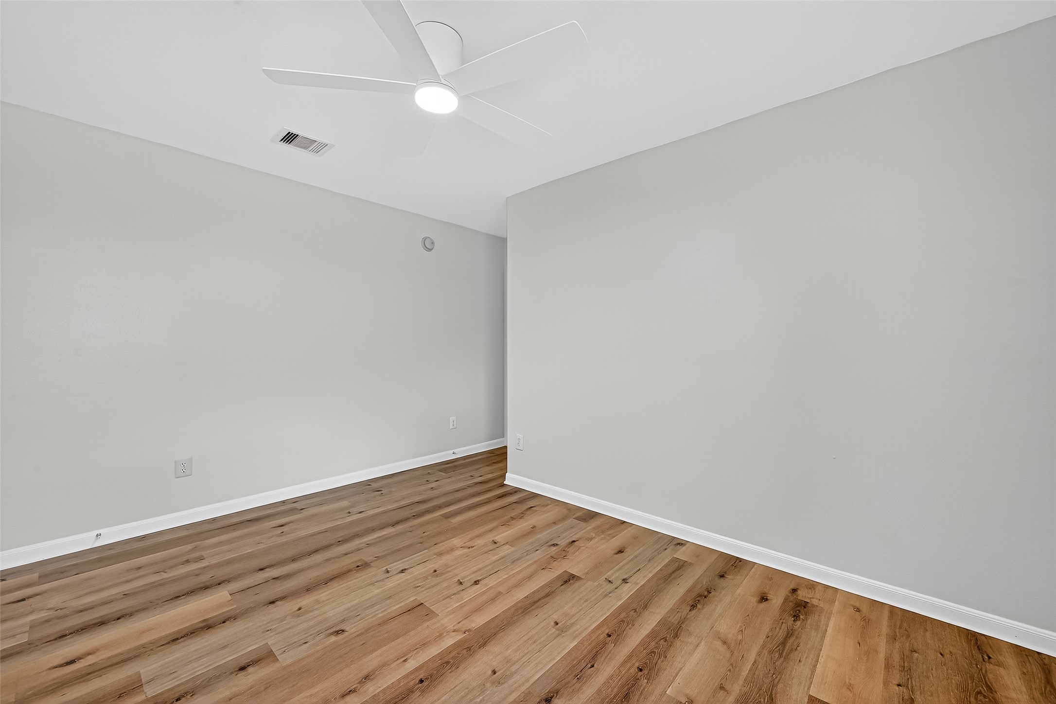 3114 Sabine Spring Lane Katy, TX 77449 - Photo 33 of 34 a view of an empty room with wooden floor