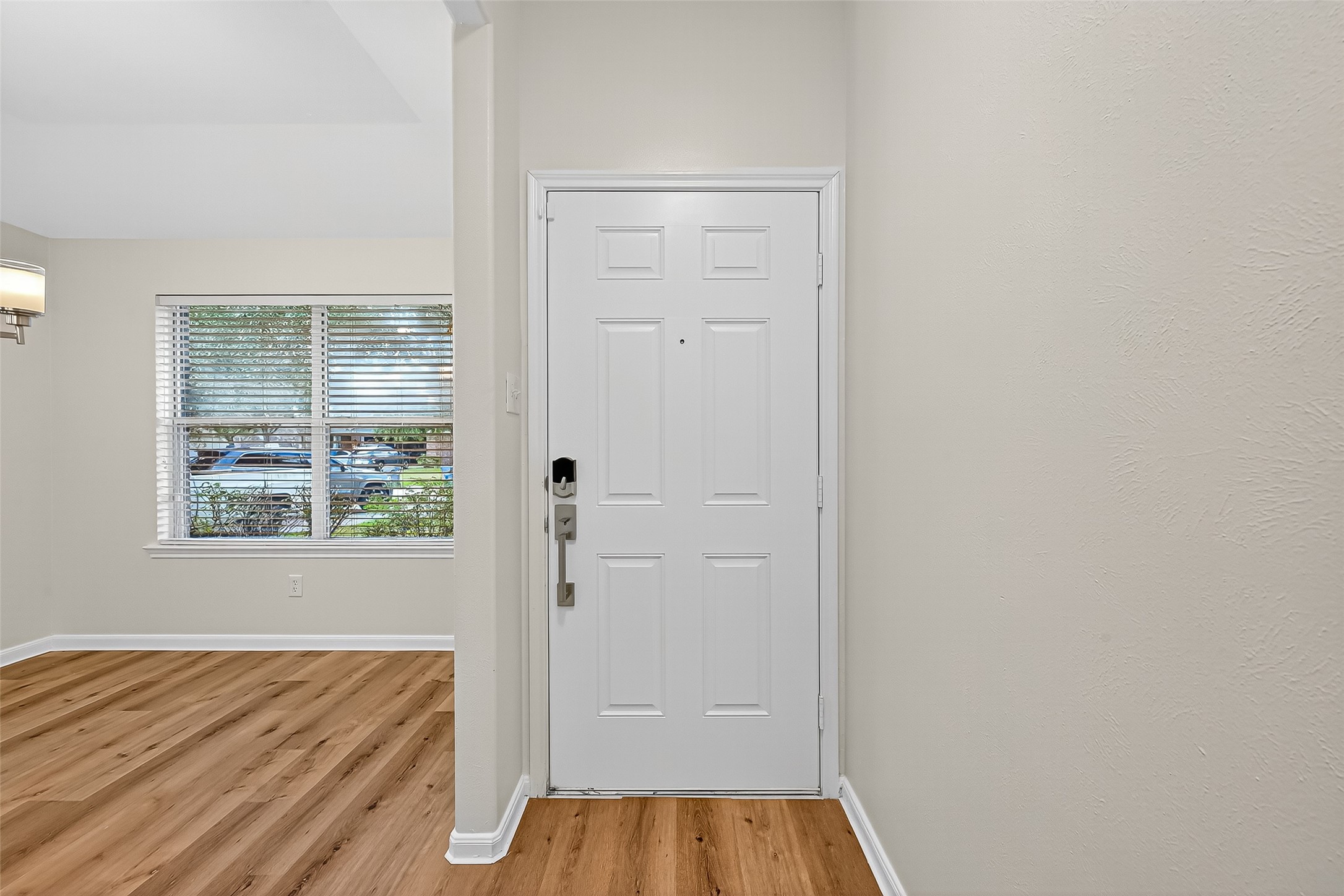 3114 Sabine Spring Lane Katy, TX 77449 - Photo 4 of 34 an empty room with wooden floor and a window