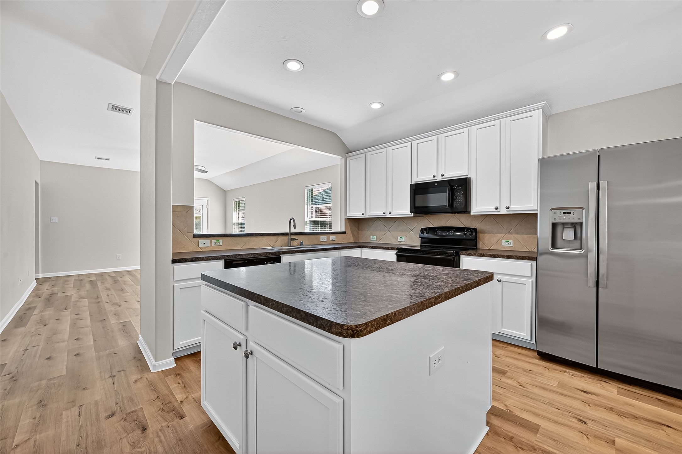 3114 Sabine Spring Lane Katy, TX 77449 - Photo 8 of 34 a kitchen with a sink stove and refrigerator