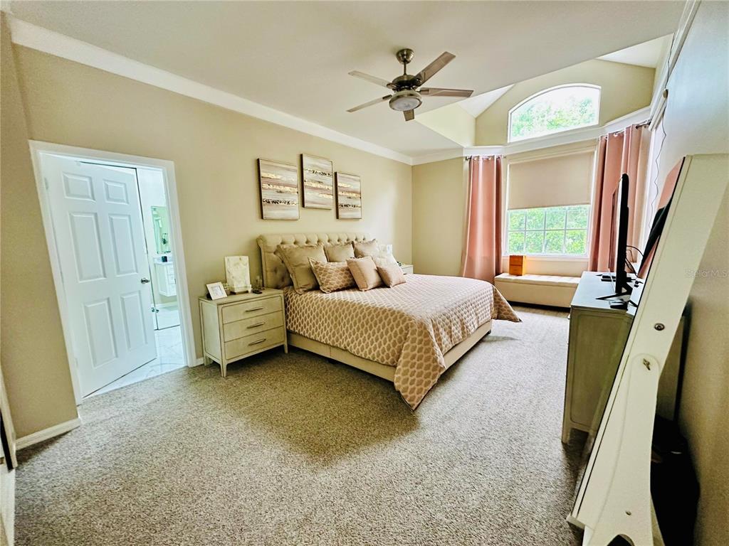 784 South Pennsylvania Avenue Winter Park, FL 32789 - Photo 21 of 29 a bedroom with a bed a couch and a window