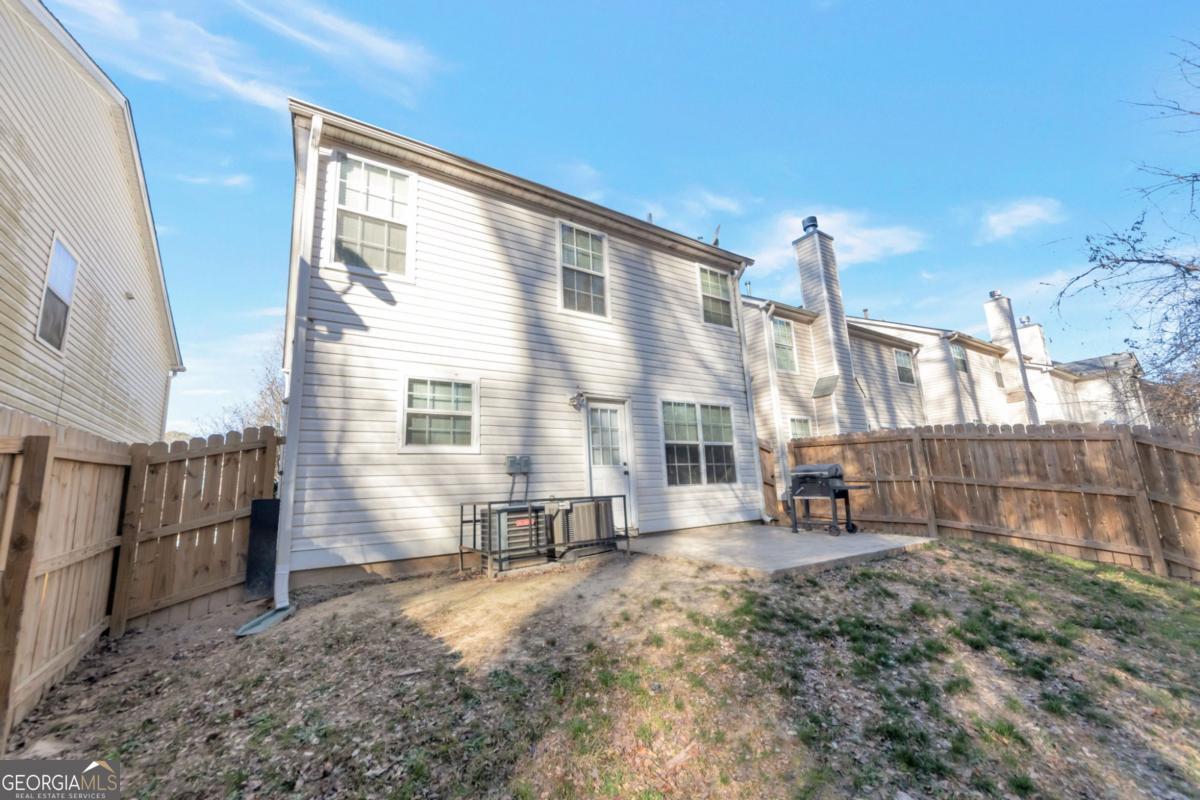 5920 Seabright Lane Atlanta, GA 30349 - Photo 16 of 18 a view of a backyard with a chair and table