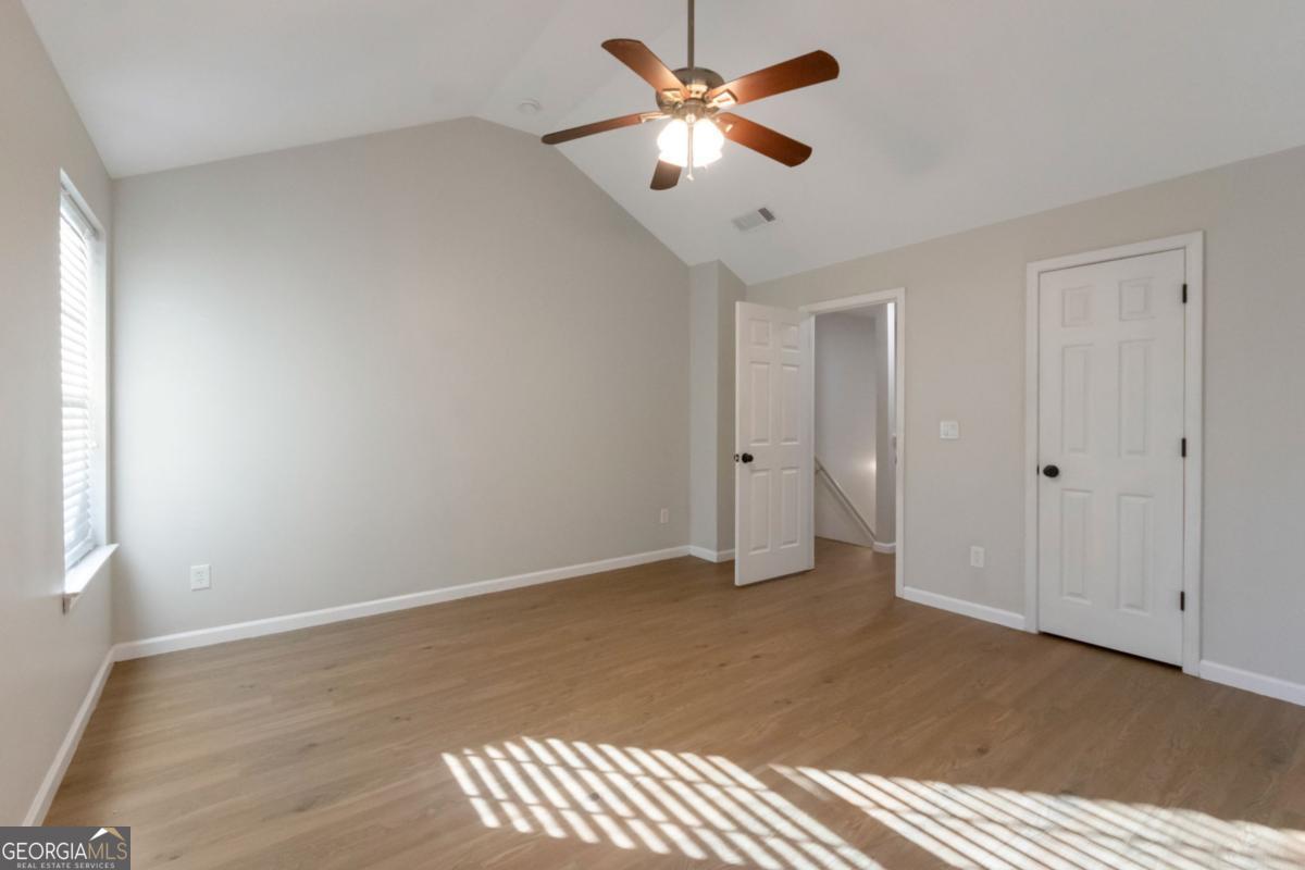 5920 Seabright Lane Atlanta, GA 30349 - Photo 8 of 18 a view of an empty room and a ceiling fan