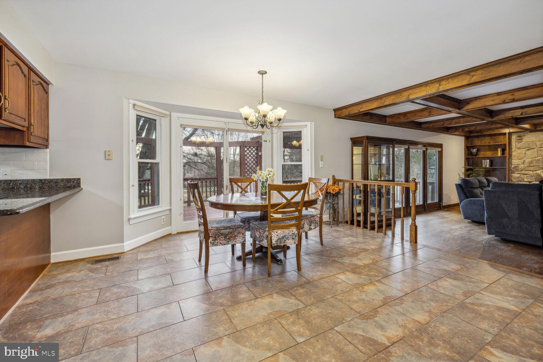 13303 Query Mill Road North Potomac, MD 20878 - Photo 11 of 42 Tile, granite, door to deck