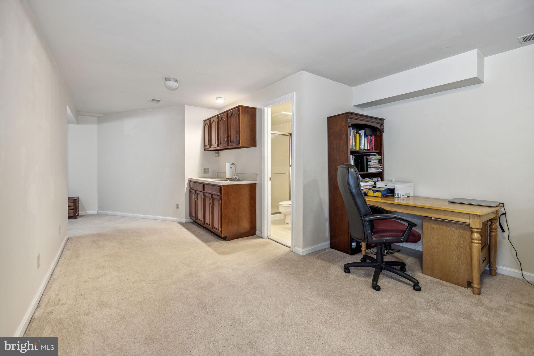 13303 Query Mill Road North Potomac, MD 20878 - Photo 28 of 42 Basement with sink and cabinets