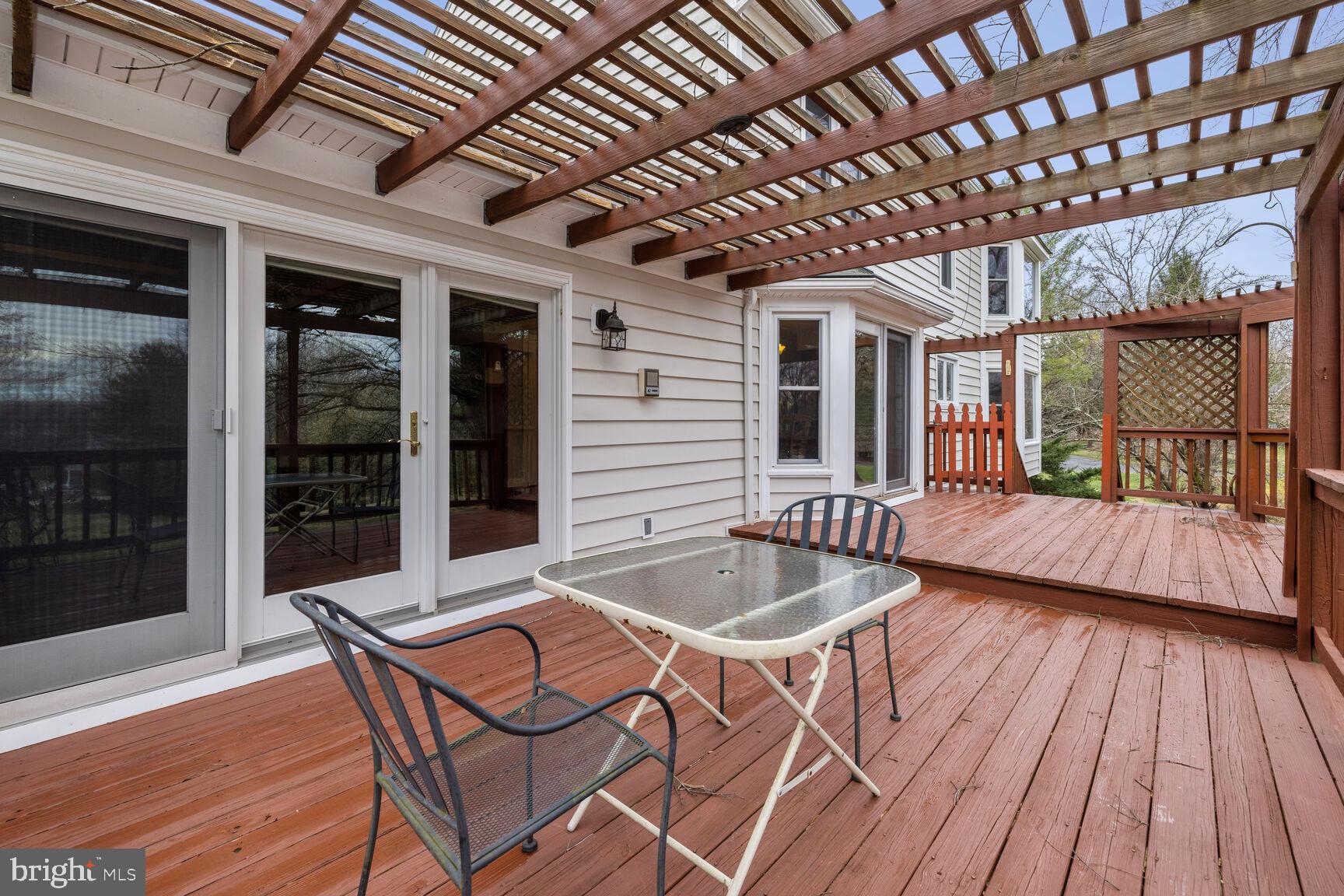 13303 Query Mill Road North Potomac, MD 20878 - Photo 34 of 42 Large wood deck, trellis for shade